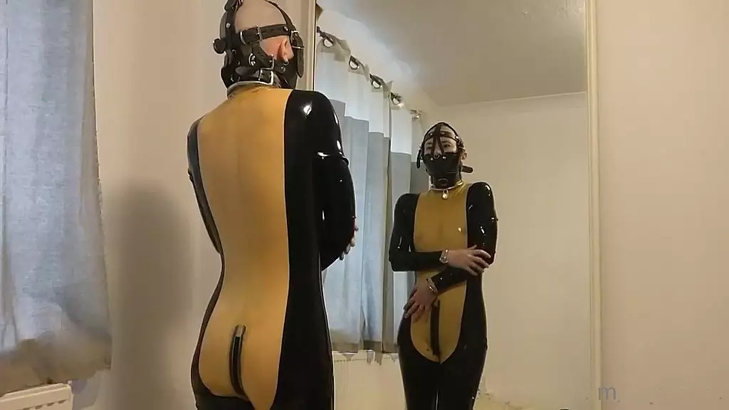 putting on my muzzle and latex catsuit.