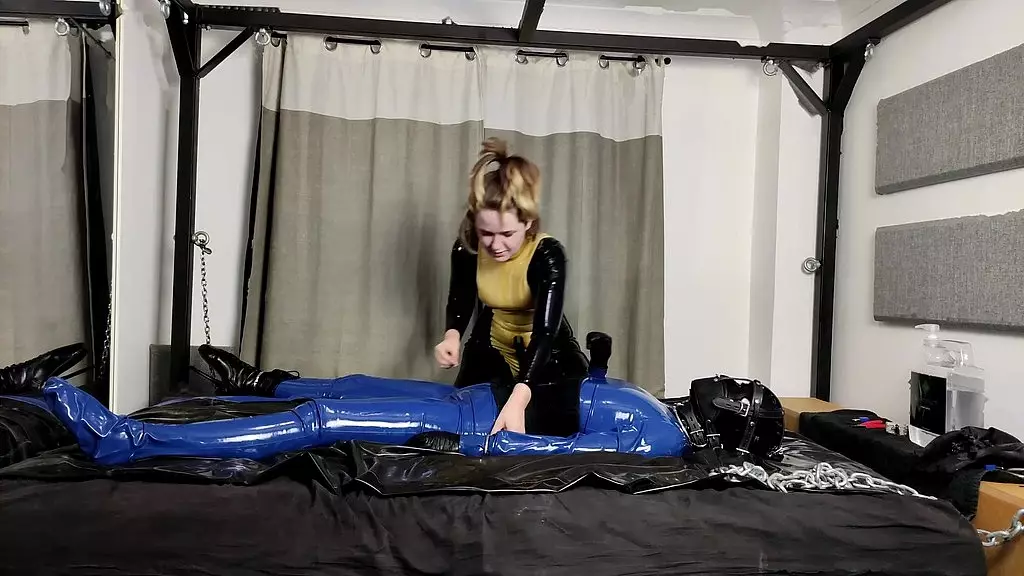 when there s this much bondage, a very warm day and lots of slippery lubed up latex, getting out of it all again is quite the...